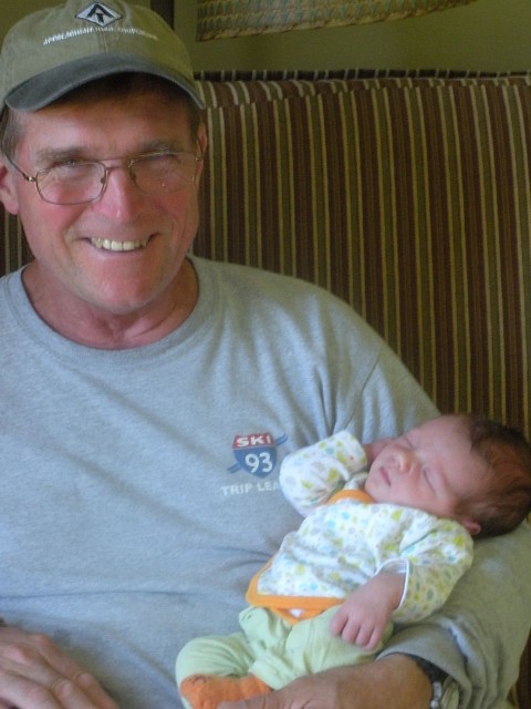 Grampy Hank, holding the heck out of the baby.